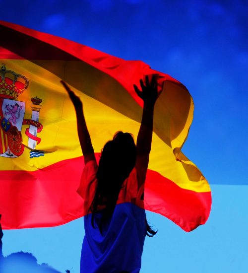 soccer supporter against flag of Spain